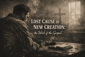 A man in his study with an open Bible.